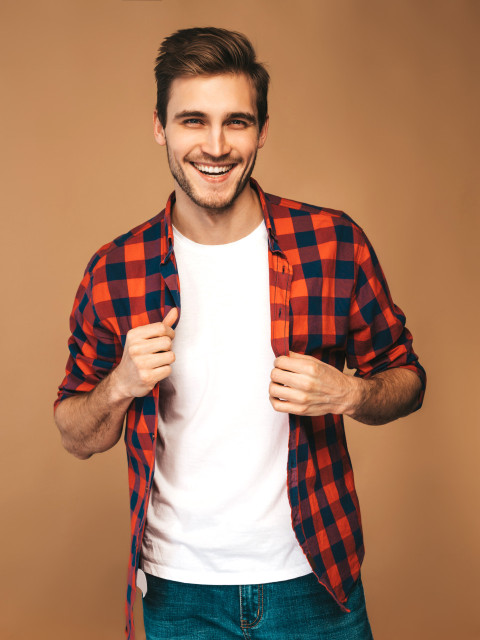 portrait handsome smiling stylish young man model dressed red checkered shirt fashion man posing